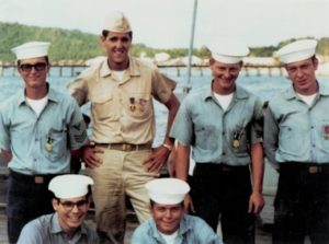 John Kerry, then a naval lieutenant, stands with his crewmen on the swift boat he commanded in South Vietnam in 1969.